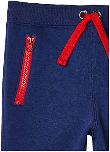 Флисовые панталони за джогинг Essentials за момичета и деца с джобове с цип (по-рано са били забелязани във формата